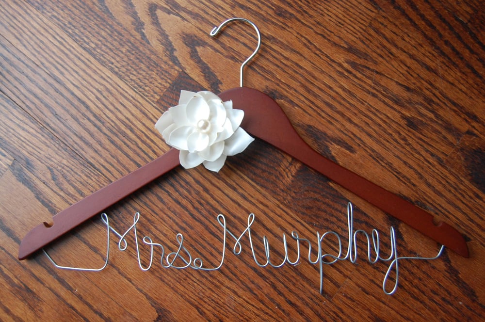 Image of customized wire name wooden hanger