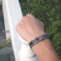 Image 3 of black ruler bangle