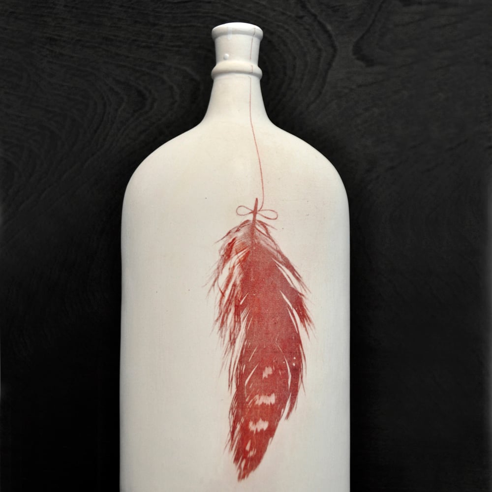 Image of feather bottle