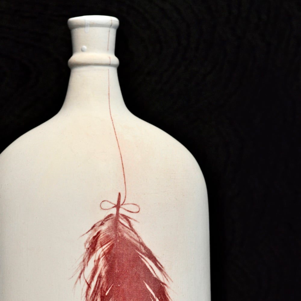 Image of feather bottle