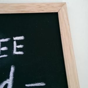 Small Chalkboard with Brown Frame on a Brown Stand