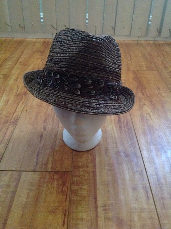 Image of brown straw fedora with almond natural feather trim