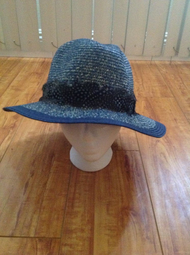 Image of navy straw with grey polka feather trim