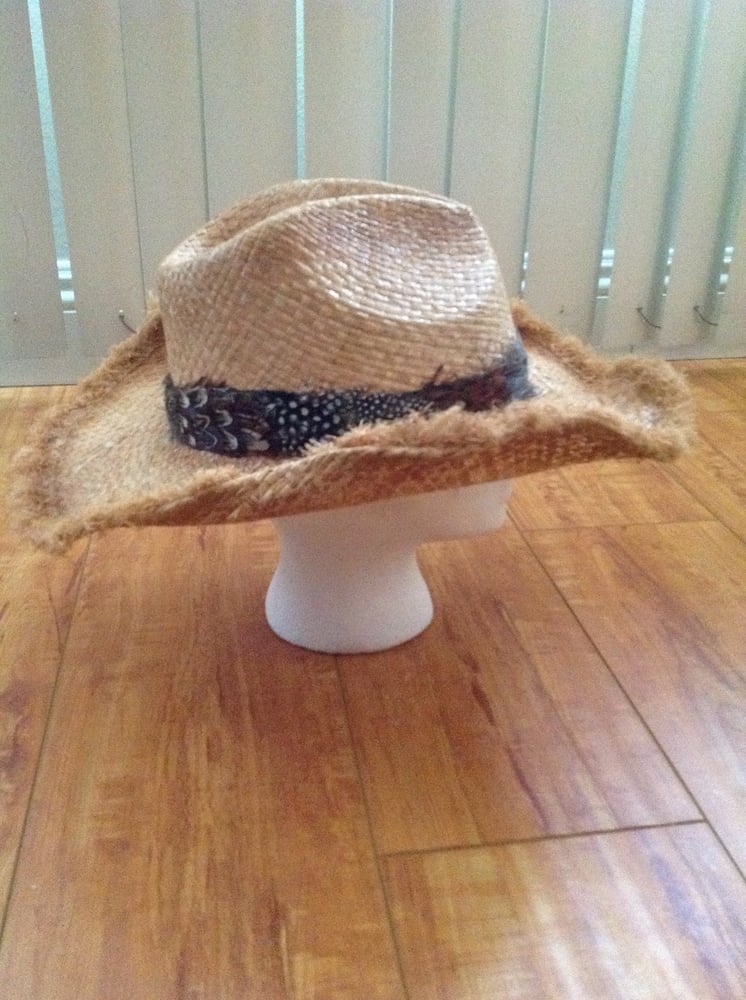 Image of creme straw cowboy with fringe rim