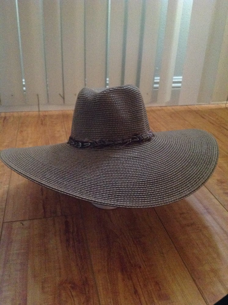 Image of mixed straw floppy with brown feather trim