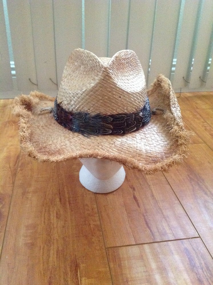 Image of creme cowboy with fringe rim