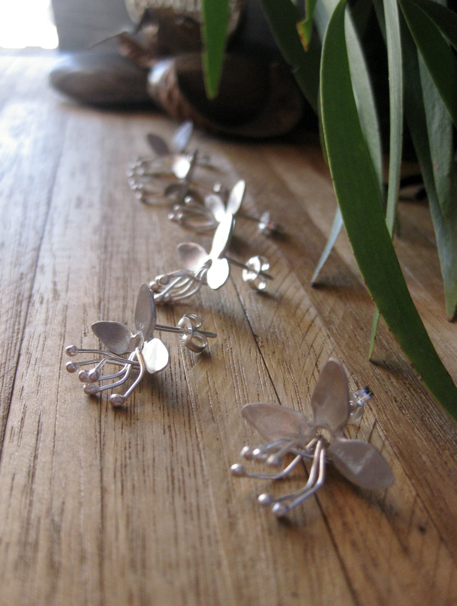 Image of Open bell flower stud earrings in forged sterling silver