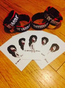 Image of Wristband, stickers and note 