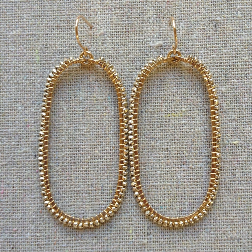 Image of Silver on gold beaded ovals