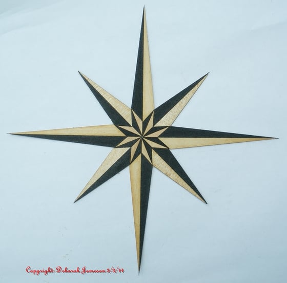 Image of Item No. 72. **HAND CUT**  Marquetry Inlay Nautical Compass Star.