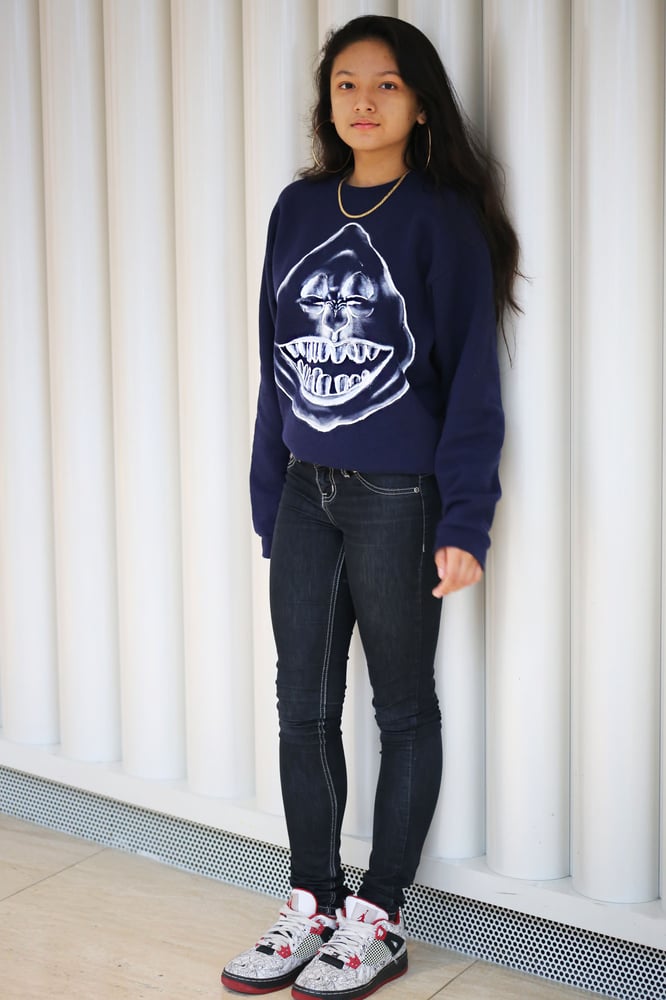 Image of white on navy crew-neck