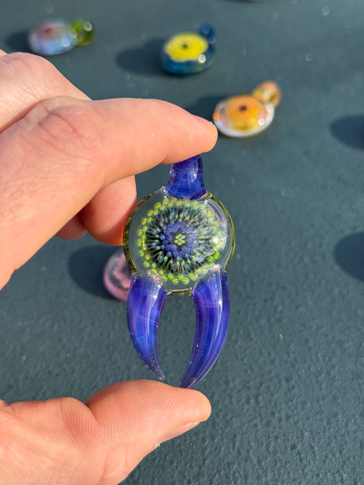 Image of  Green and purple horned pendant