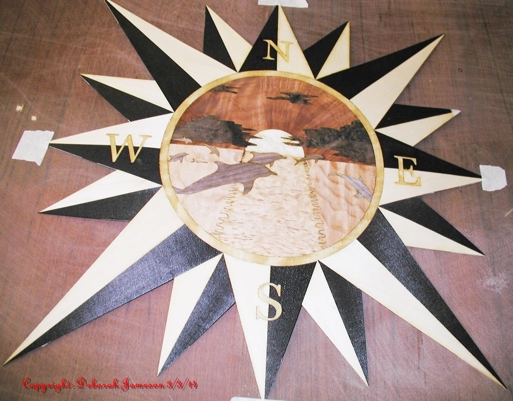 Image of Item No. 122. Star with Marquetry detail of a Lighthouse.