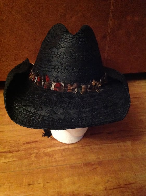 Image of black straw cowboy with mixed feather band