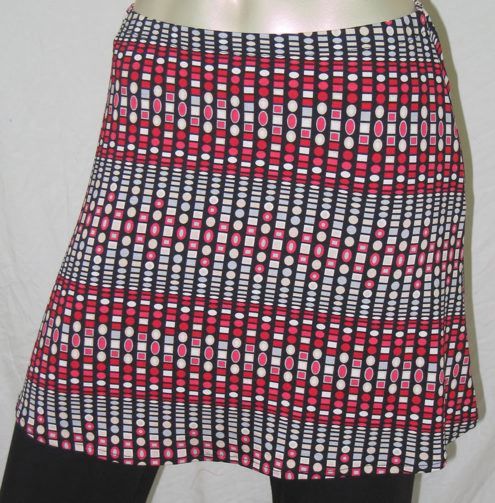 Image of Short ladies skirt red spot