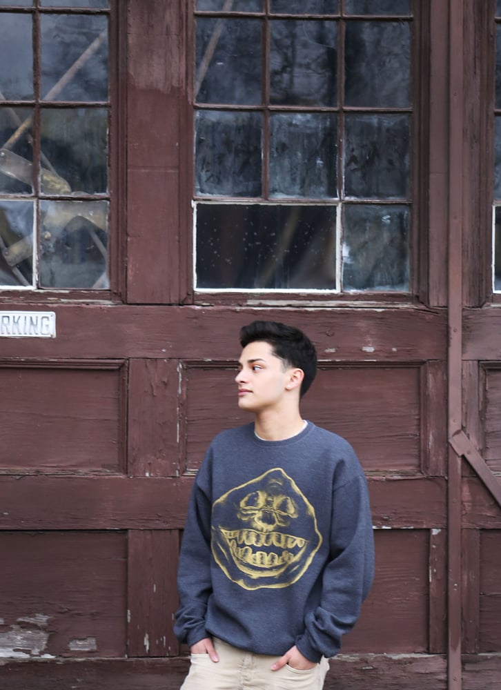 Image of gold on dark grey crew-neck