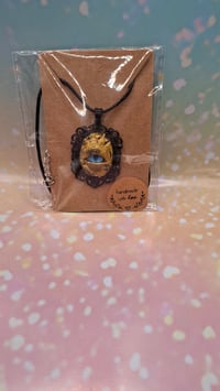 Golden dragon eye pendant 