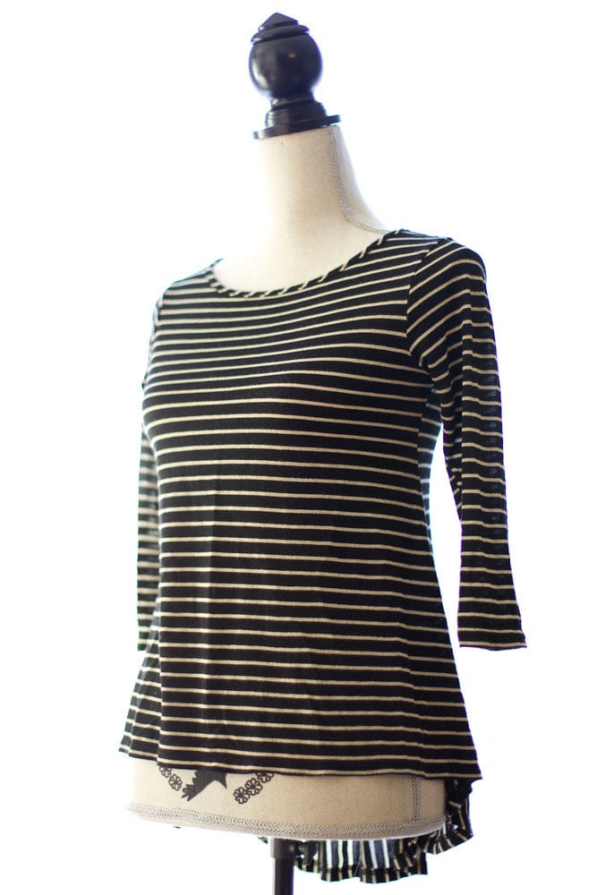 Image of black + gold striped shirt