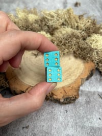 Image 1 of D6 Dice Pair Blue with Gold Star Pips