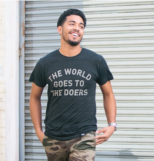 Image of The World Goes to The Doers Tee (Tri-Black)