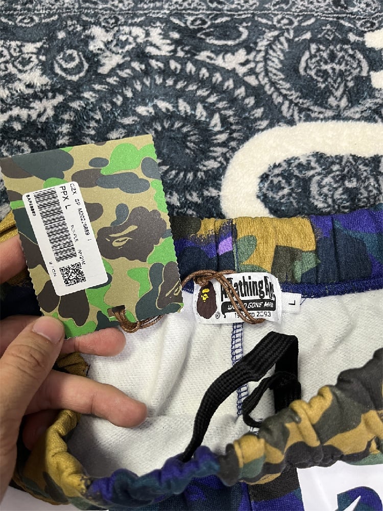 Image of BAPE x Heron Preston Mix 1st Camo Sweatpants