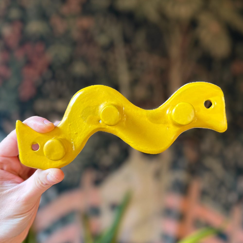 image of big mustard wall hook