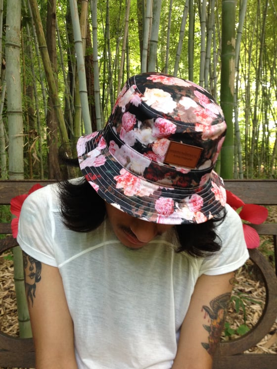 Image of "Posse Corrumpere" Floral Bucket Hat