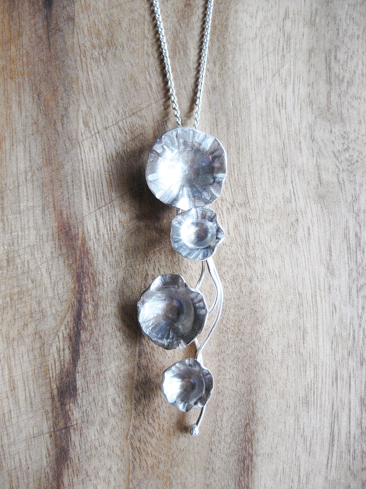 Image of Trailing daisy pendent in forged sterling silver