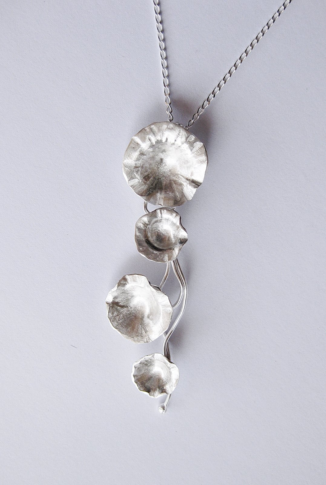Image of Trailing daisy pendent in forged sterling silver