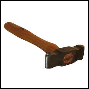 Image of Shelby Raising Hammer