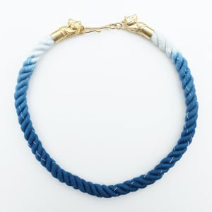 Image of Brass Horse Necklace with Blue and White Cotton Cord