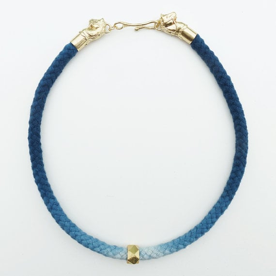 Image of Brass Horse Necklace with Blue and White Cord and Brass Bead