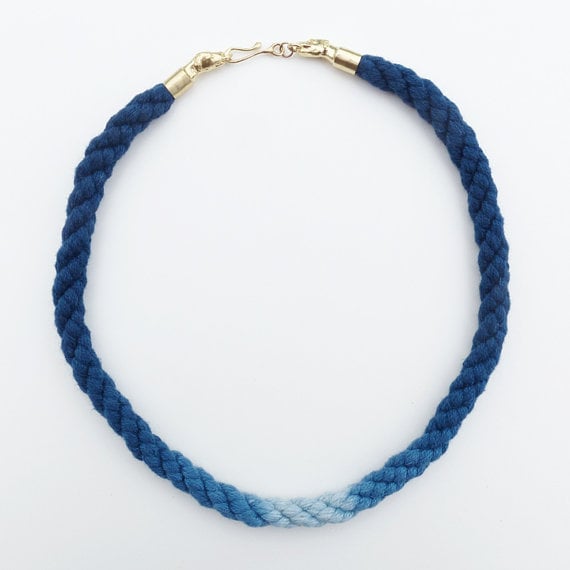 Image of Brass Dog Necklace with Blue and White Cotton Cord