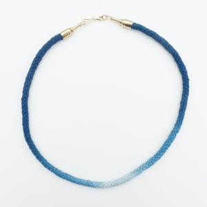 Image of Brass Pawn Necklace with Blue and White Cord