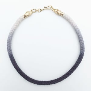 Image of Brass Swan Necklace with Gray and White Cord