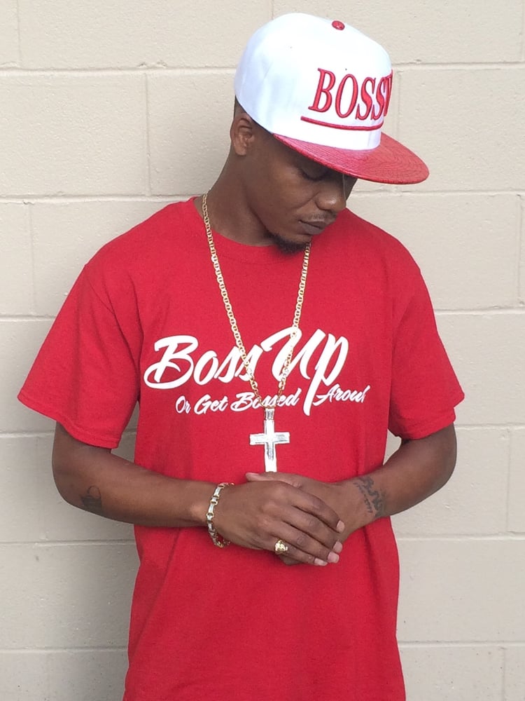 Image of Our red or royal blue signature t-shirts with “BossUp Get Bossed Around” printed in white.