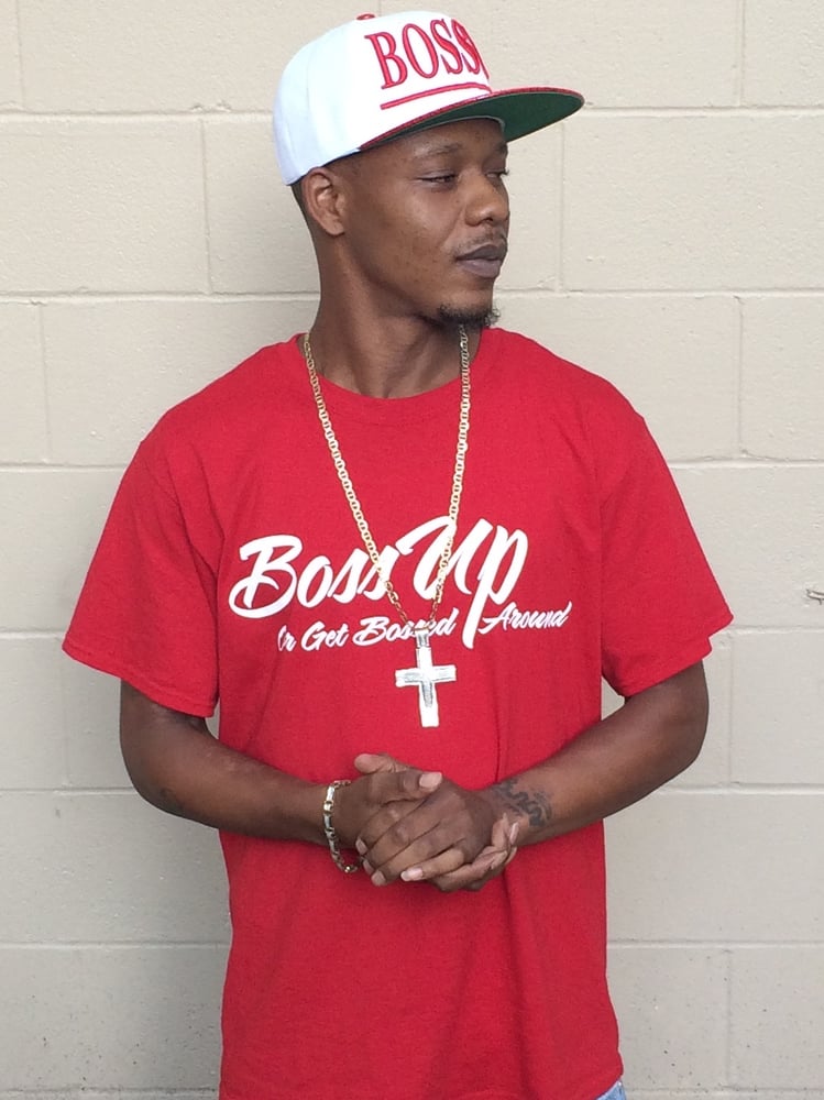 Image of Our red or royal blue signature t-shirts with “BossUp Get Bossed Around” printed in white.