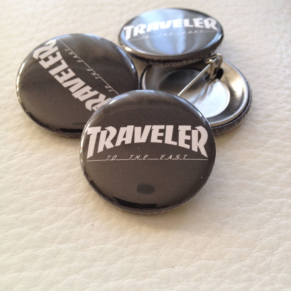 Image of Traveler button.