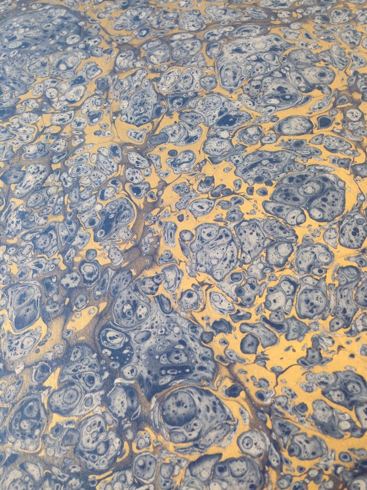 Image of Marbled paper #83 'Frost' on blue base paper 