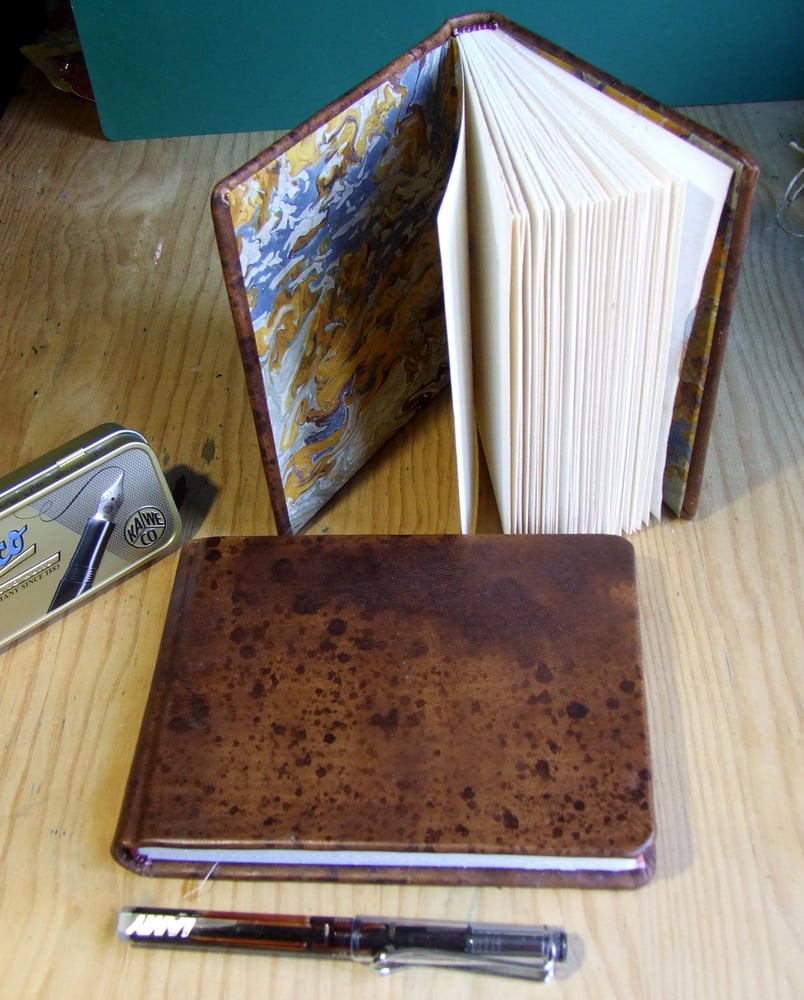 Image of Sketchbook with brown leather bookbinding. (16,5x13,5)