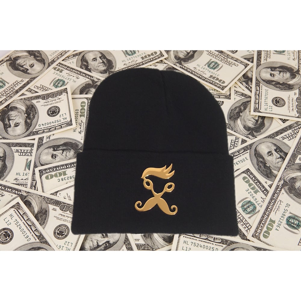 Image of Gold metal R.B.S logo pendant on black beanie