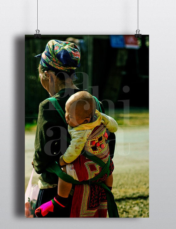 Image of Hmong Grandmother carrying her Grandson