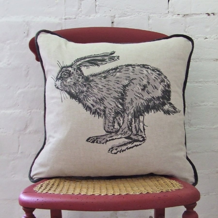 Image of RUNNING HARE CUSHION, LINEN. 