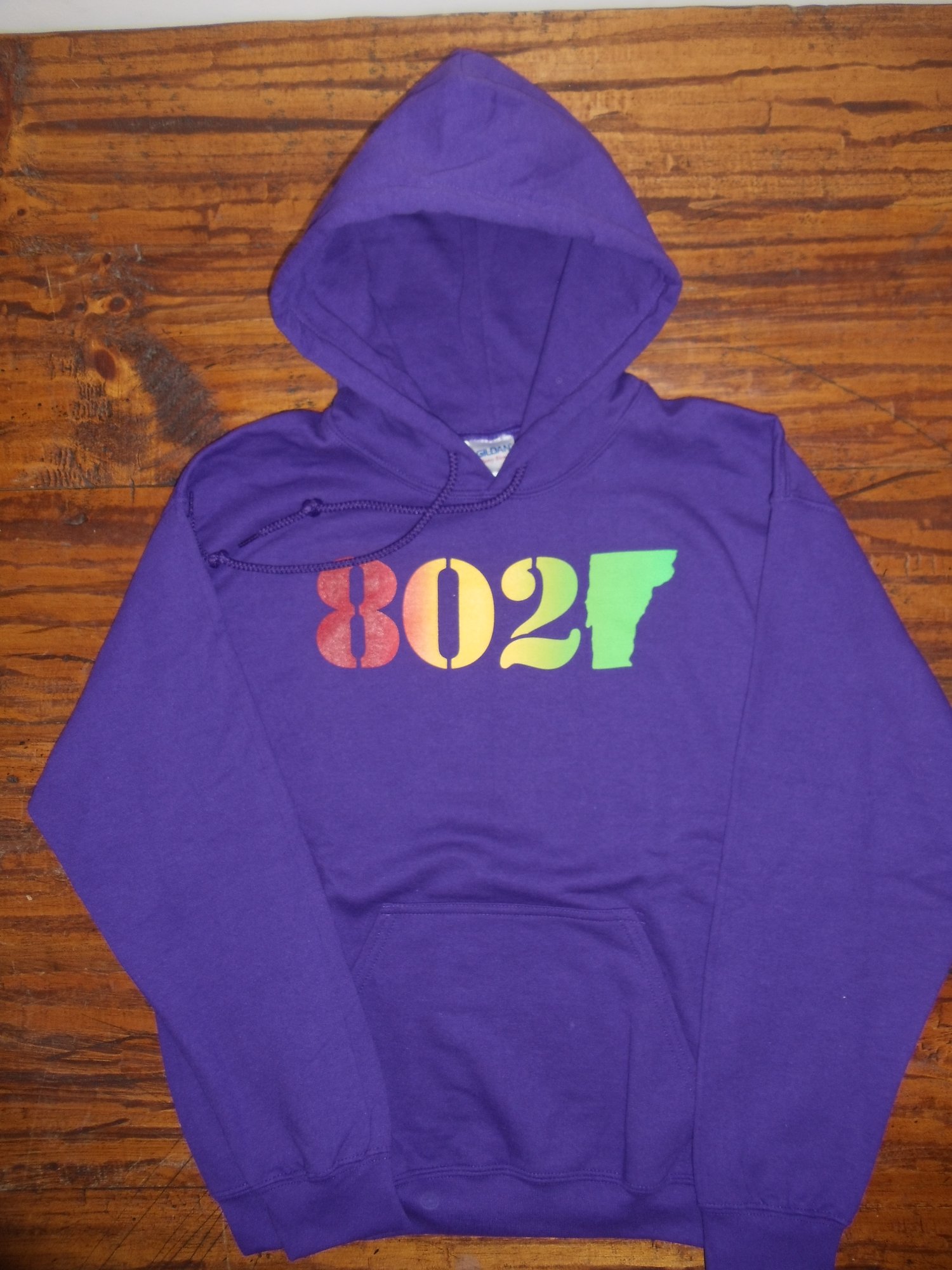 Image of 802 Classic Vermont Hooded Sweatshirt - Red, orange, yellow, green (Rasta) 802 logo on Purple Hoodie