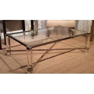 Image of Lucite and brass "X" stretcher coffee table, with glass insert top