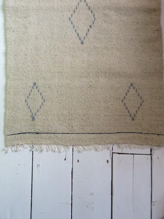 Image of Simple hand-woven bedside rugs