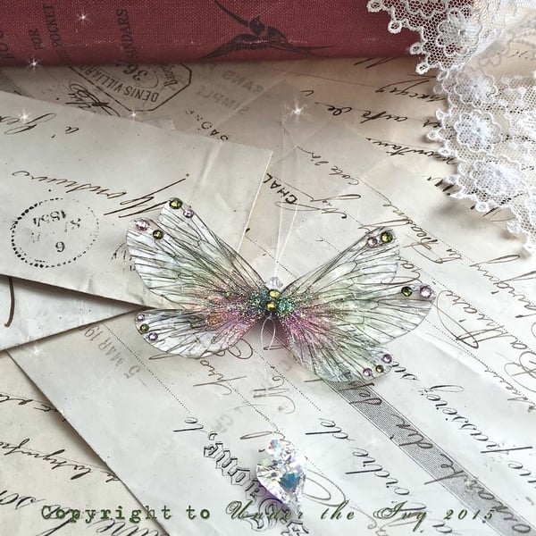 Image of Small green and pink rainbow wing hanging decoration