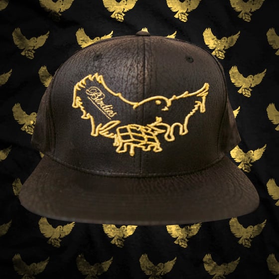 Image of Brown/Gold Dripping Birdies Cracked Leather Snapback