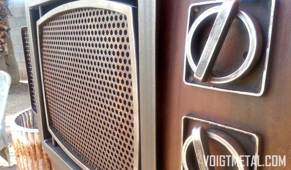 Image of "Nothings ever on" Voigt Metal T.V.-Outdoor wood burning fireplace