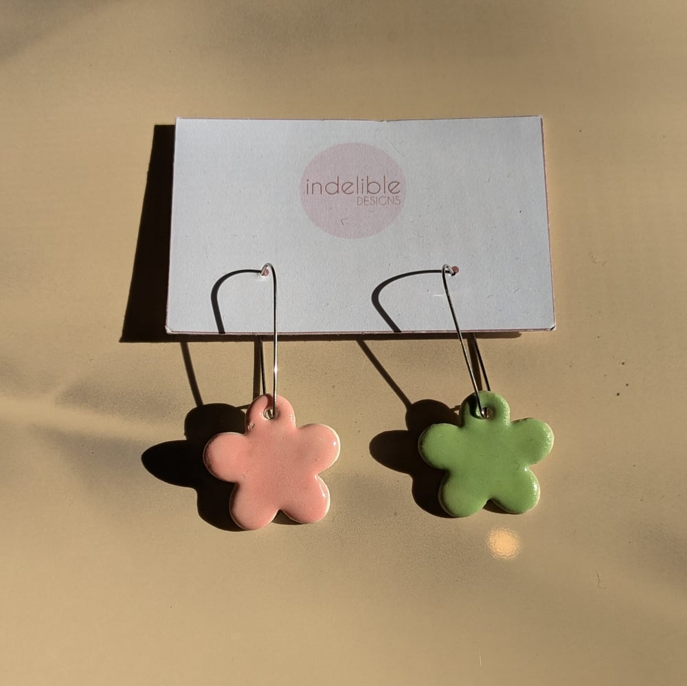 Image of pink and green daisy asymmetrical earrings